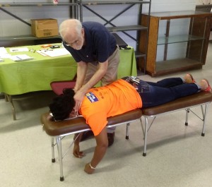 Dr. Brown performing a spinal analysis